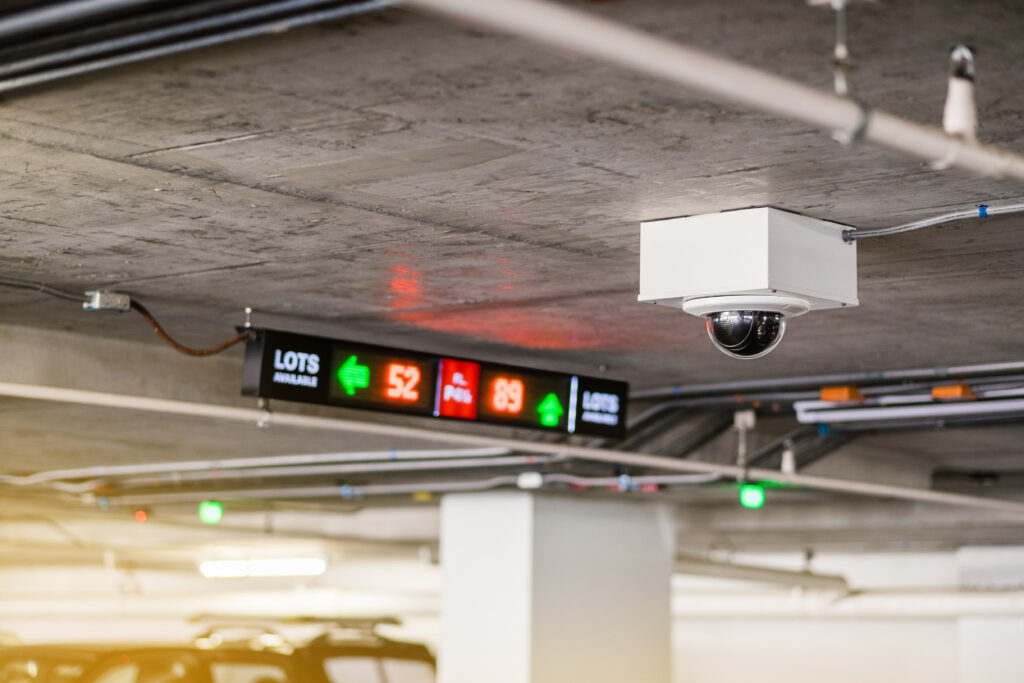 Modern parking facility with smart parking technology including IoT sensors and EV charging stations