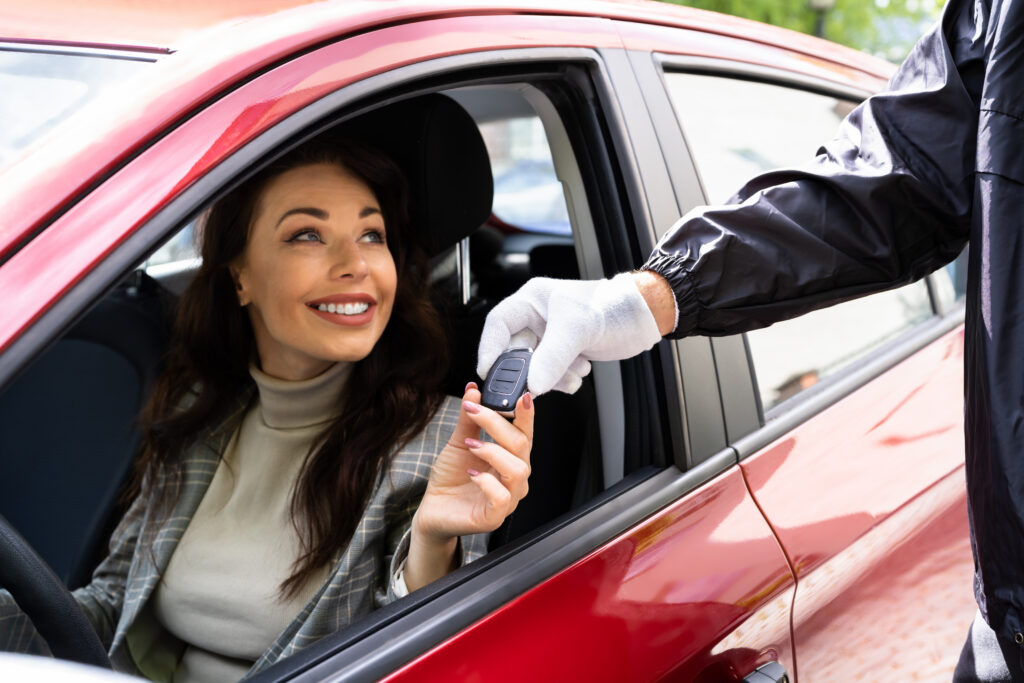 Residential valet parking attendant at luxury apartment entrance
